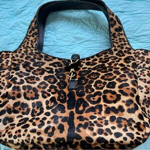 Stylish Leopard Print Tote with Black Accents. Luxurious.